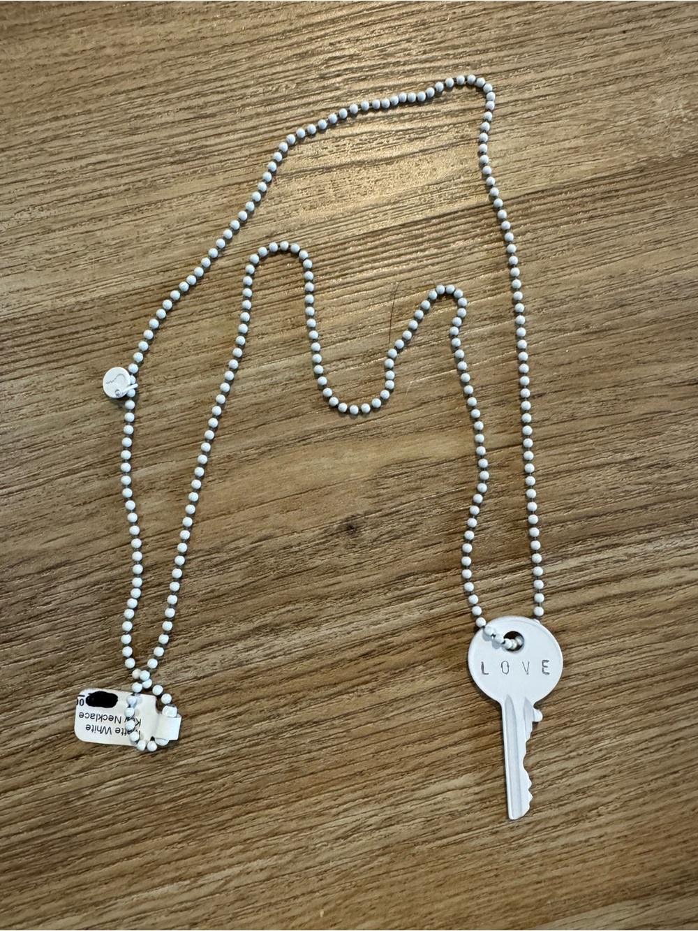 The Giving Keys Matte White Key “LOVE” Necklace